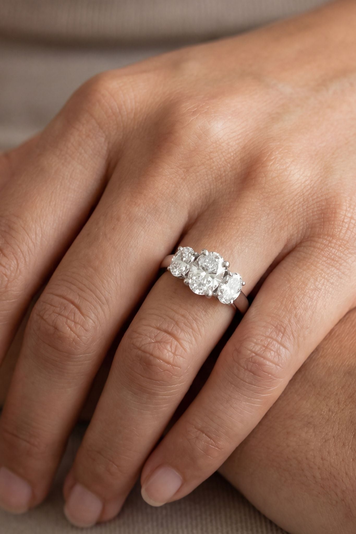 Oval Brilliant Cut Diamond Three Stone Ring in Platinum